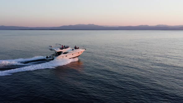 Fast moving motor yacht at the sea.