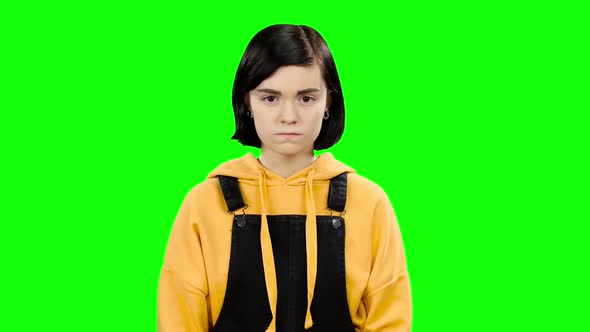 Teenage Girl Shows a Heart Shape. Green Screen