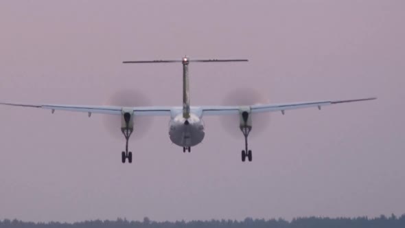 HD - Turboprop aircraft landing on runway. Close-up