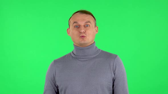 Portrait of Wow Man Emotion. Green Screen at Studio