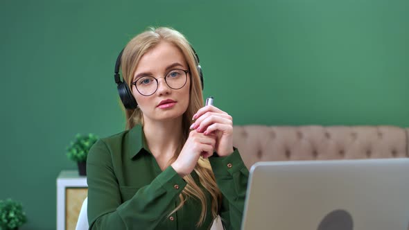 Portrait of Woman in Headphones Worker of Customers Service Support