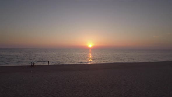 Aerial view of a sandy beach at sunset in Kathisma, Lefkas island, Greece.