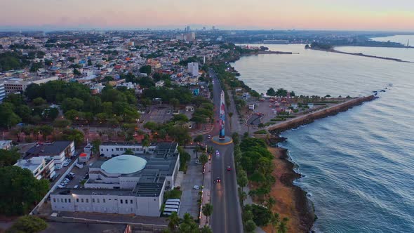 Forward flight with drone on the boardwalk of Santo Domingo early in the morning