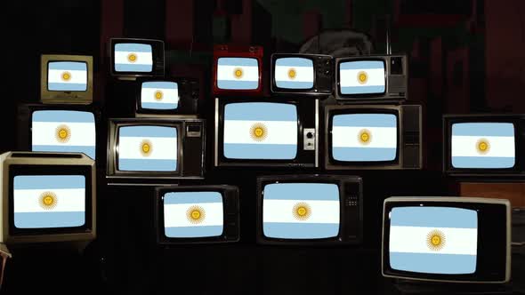 Pile of retro Televisions and the Flag of Argentina.