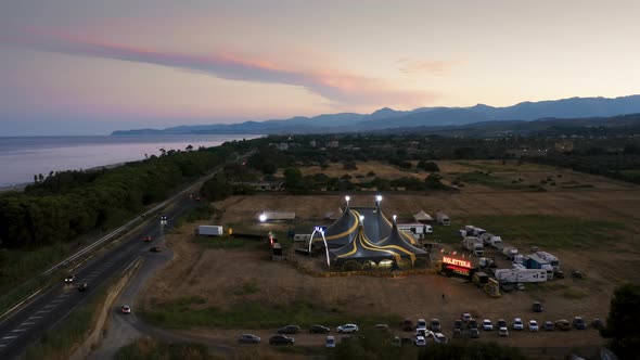 Big Top of a Circus with Caravans in a Field