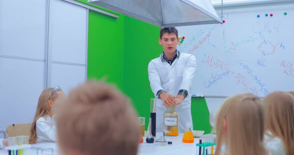 Young Boys and Girls is Making Chemistry Experiments