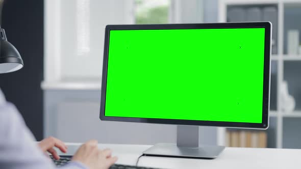 Woman with Green Screen Computer