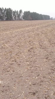 Vertical Video of a Field with Plowed Land in Autumn Slow Motion