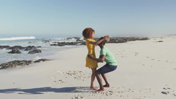 African American couple enjoying seaside