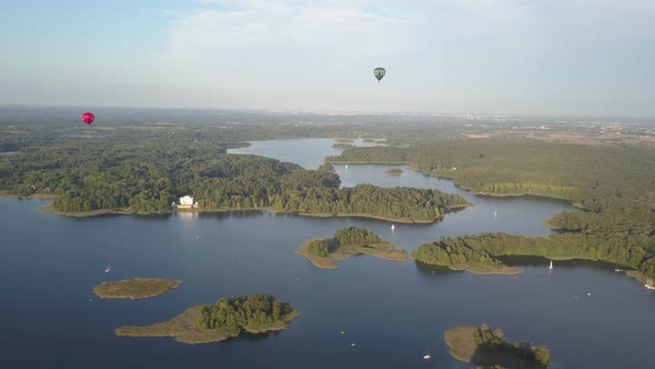 Large Hot Air Balloons Are Visible in the Sky Over Famous Trakai Castle on a Small Island . Remote