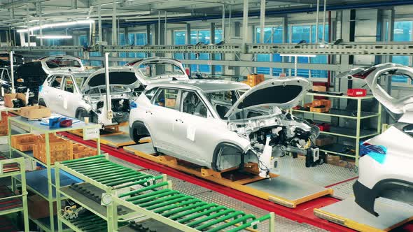 Unfinished Automobiles Put in a Row in the Factory Facility. Car Assembly Line, Automobile Industry