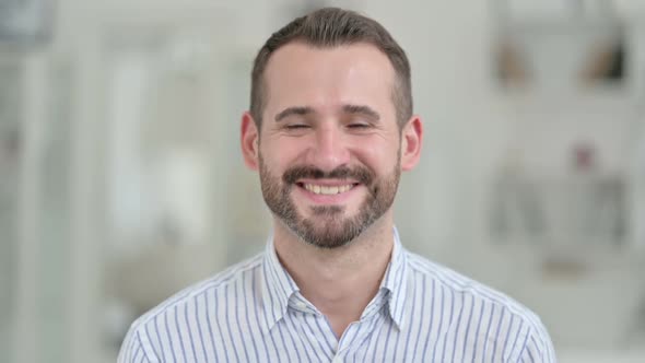 Portrait of Young Man Saying Yes By Shaking Head