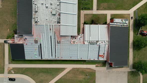 Drone View of an Industrial Roof Roofers Installing a New Roof on an Industrial Building