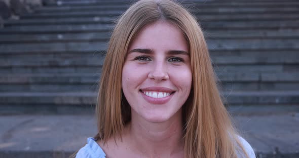 Young caucasian woman smiling on camera