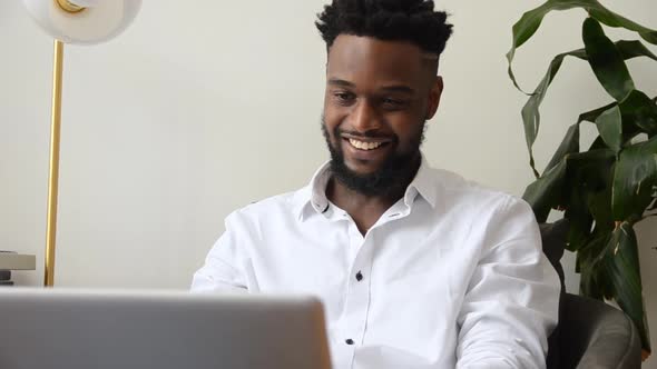 Close Up of Man Using a Laptop