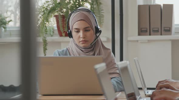 Muslim Woman Working in Call Center