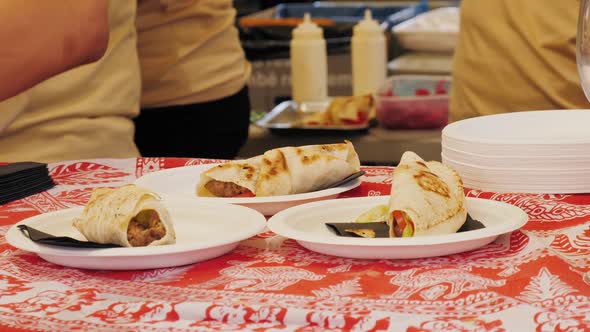 Mexican Tacos Shells with Beef Meat on Street Food Festival Onion Chef Cooking on Grill Traditional