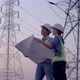 Two specialist electrical engineer working near to High voltage tower. - VideoHive Item for Sale