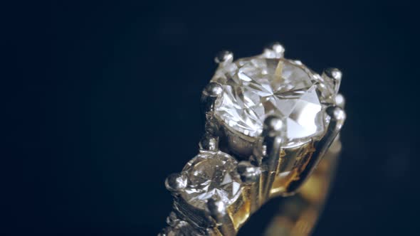 Extreme detailed of diamond ring close up shot while rotating on dark background