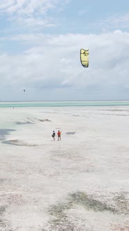 Tanzania  Vertical Video Kitesurfing Near the Shore of Zanzibar Slow Motion