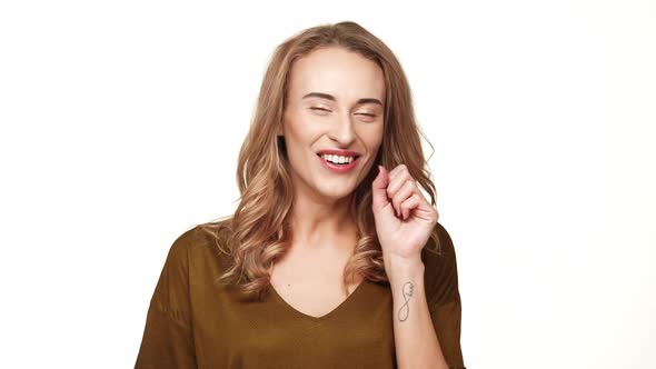 Charming Middleaged Female with Long Brown Hair Yawning Stretching and Smiling on White Background