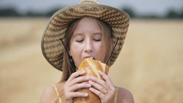 Hungry Child Eating Bread in Wheat Field Summer Outdoor Lifestyle