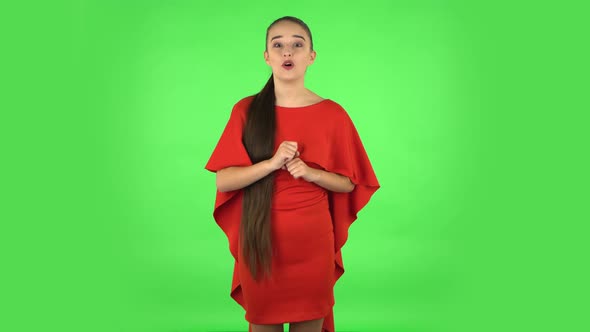 Pretty Young Woman Is Reporting and Telling a Lot of Interesting Information. Green Screen