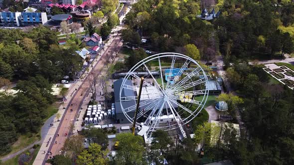 Huge crane building white Ferris wheel in Palanga, aerial view