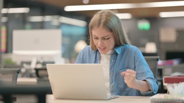 Young Woman Feeling Angry While Using Laptop