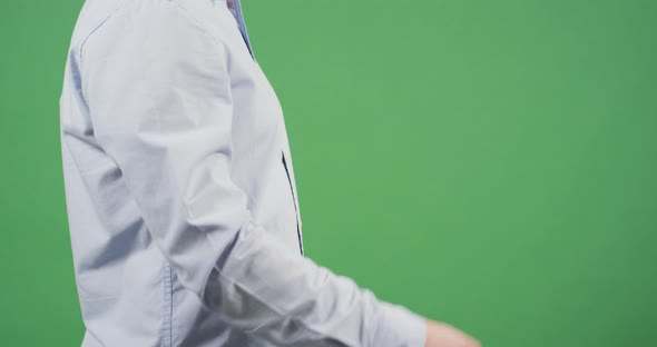 Side view of a man gesturing money alt