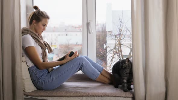 Girl Student Preparing for the Literature Exam and Reading a Book