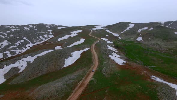 long road over snowy mountains