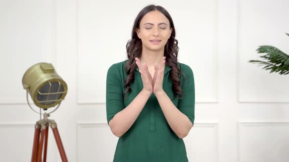 Indian praying to God