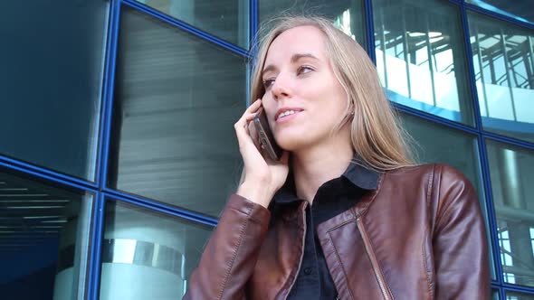 Beautiful Business Woman Talking On The Phone In A Modern City