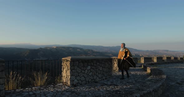 Norman warrior walks along the road