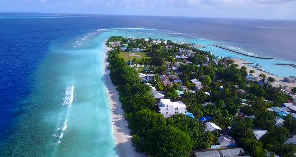 Luxury drone travel shot of a summer white paradise sand beach and aqua blue water background in hig