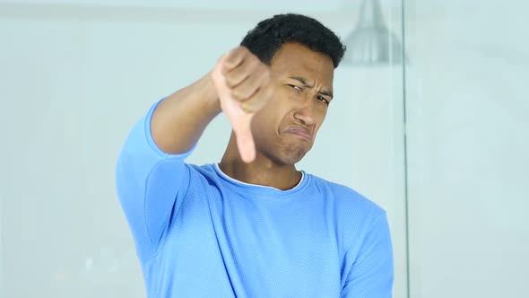 Thumbs Down by Afro-American Man