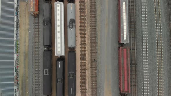 Top Down Aerial of Train Cars Parked in Railway Station