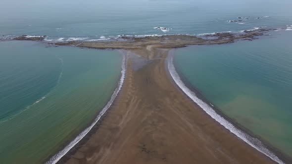 Drone shot flying over Whale Tail Beach in Ballena Marine national park