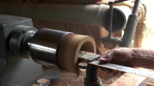 Carpenter Working with Equipment at His Workshop.