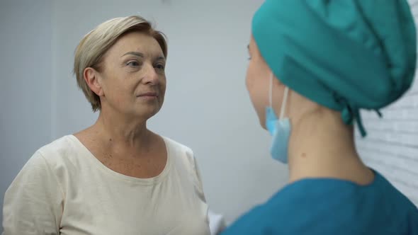 Woman Listening to Good News From Doctor and Hugging Her, Recovery, Remission