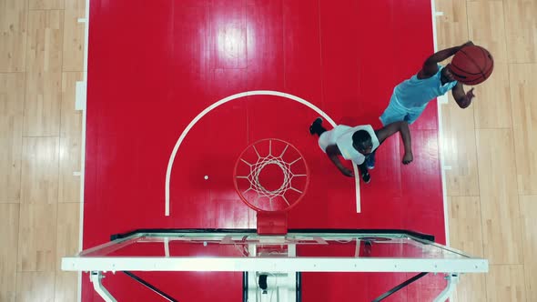 Top View of Two African Ethnicity Basketball Players Competing with Each Other