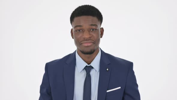 African Businessman Shaking Head As Yes Sign on White Background