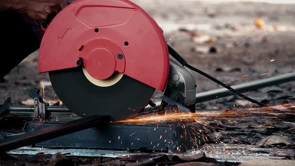 Worker Cutting Metal