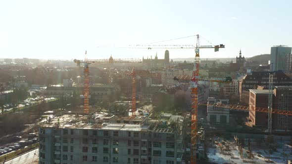 Aerial View of a Construction Site with Cranes and Heavy Machinery