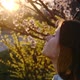 Girl Takes off a Medical Mask and Breathes Deeply of the Spring Blossom after Coronavirus Quarantine - VideoHive Item for Sale