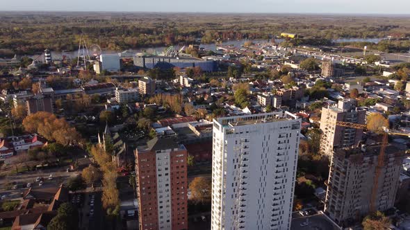 Aerial view showing apartment blocks in Tigre City beside river during sunset time,Argentina