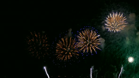 Colorful Firework display at night on sky background