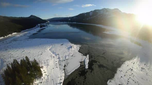 Snow Covered Lake Keecheleus Pacific Northwest Aerial At Golden Hour