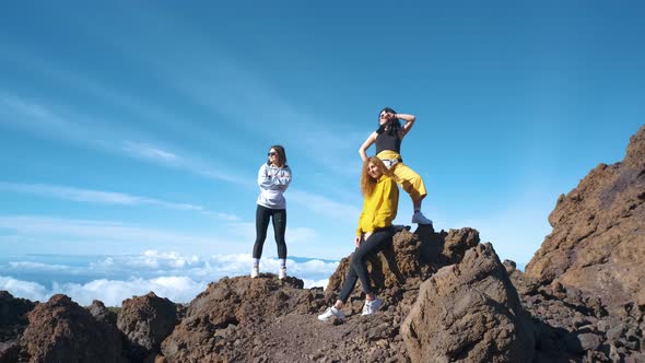 A Group of Tourists Walk Through the Mountains of Solidified Lava in the Teide Volcano National Park